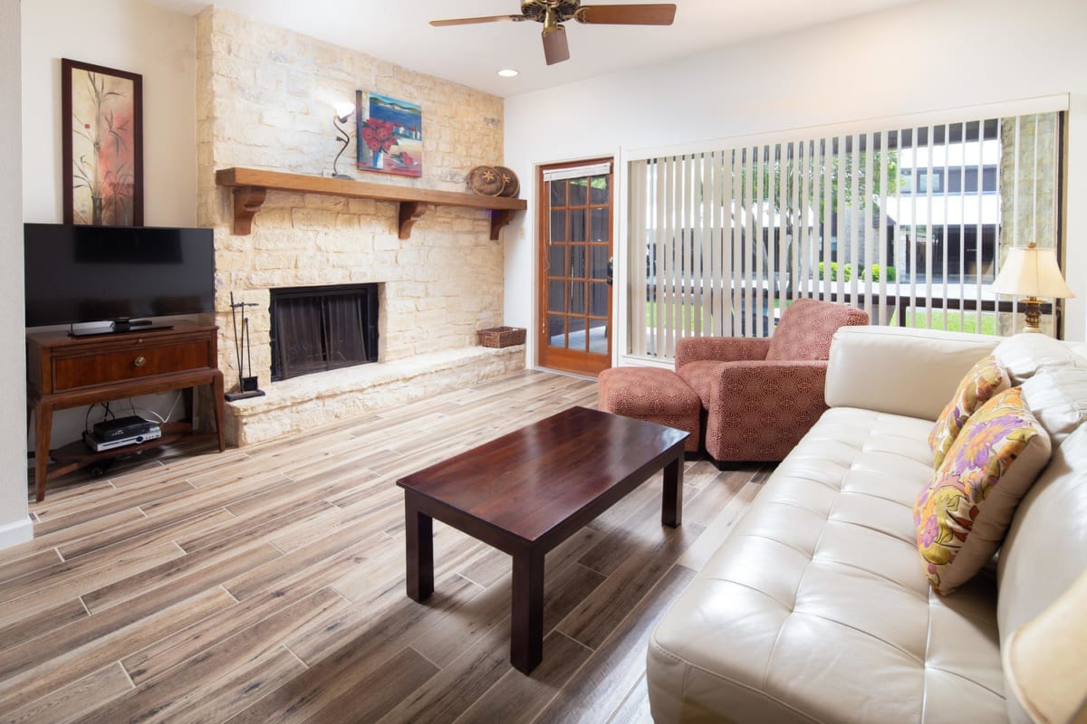 Camp Warnecke condo living room with fireplace.