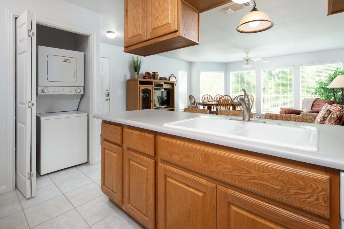 Waterwheel condo kitchen and laundry closet.