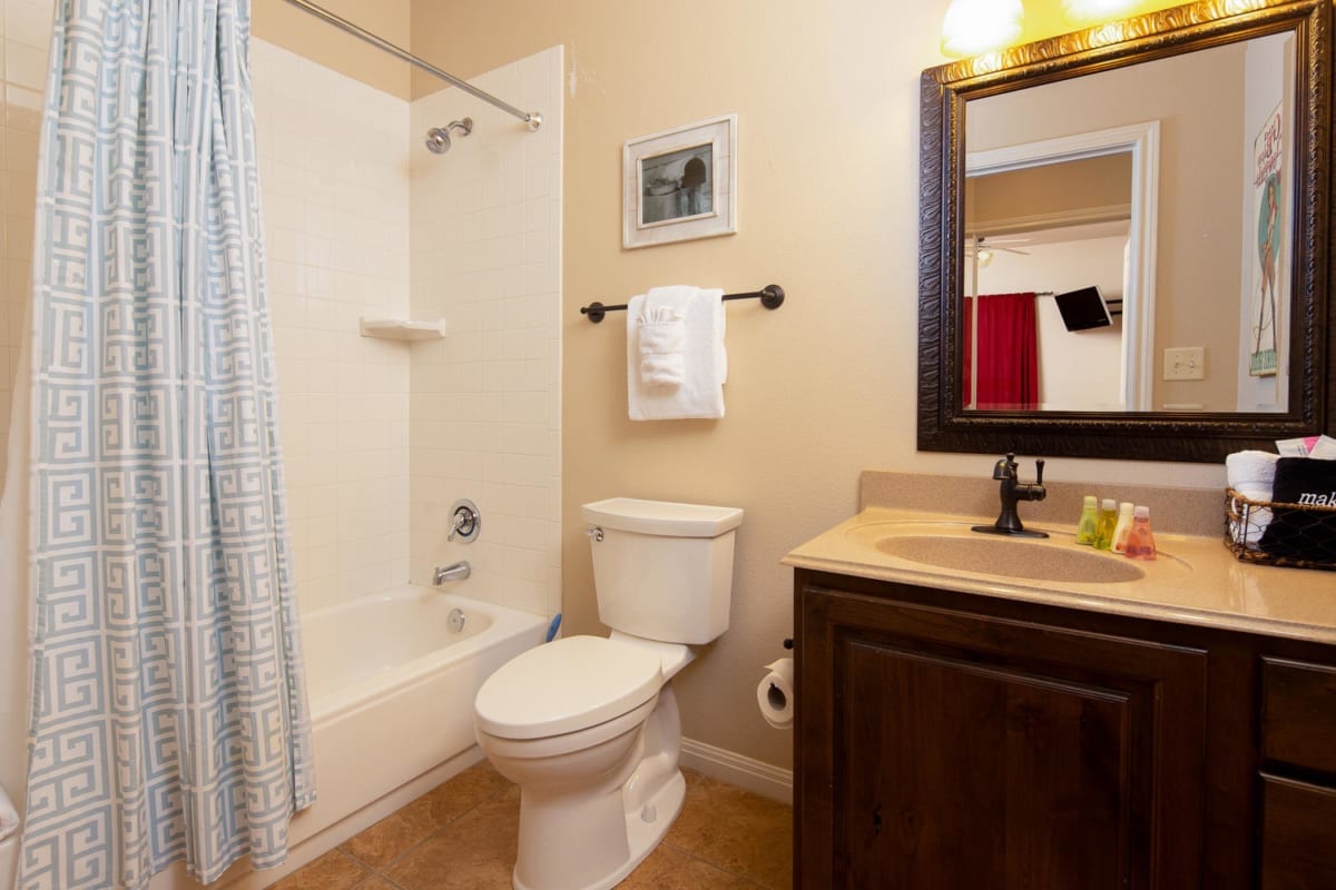 Village at Gruene condo bathroom with shower/tub combo.