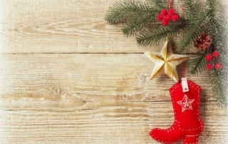 Christmas decorations with star and cowboy boot stocking.