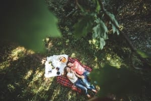 Photo of a Couple Picnicking During a Romantic Getaway in Texas.