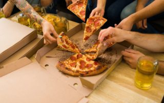 People eating Pizza in New Braunfels.