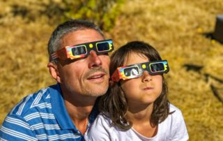 A man and a girl at the Best Place To See Total Solar Eclipse 2024.