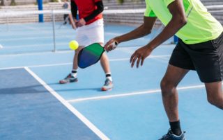 Two people playing Pickleball in New Braunfels.