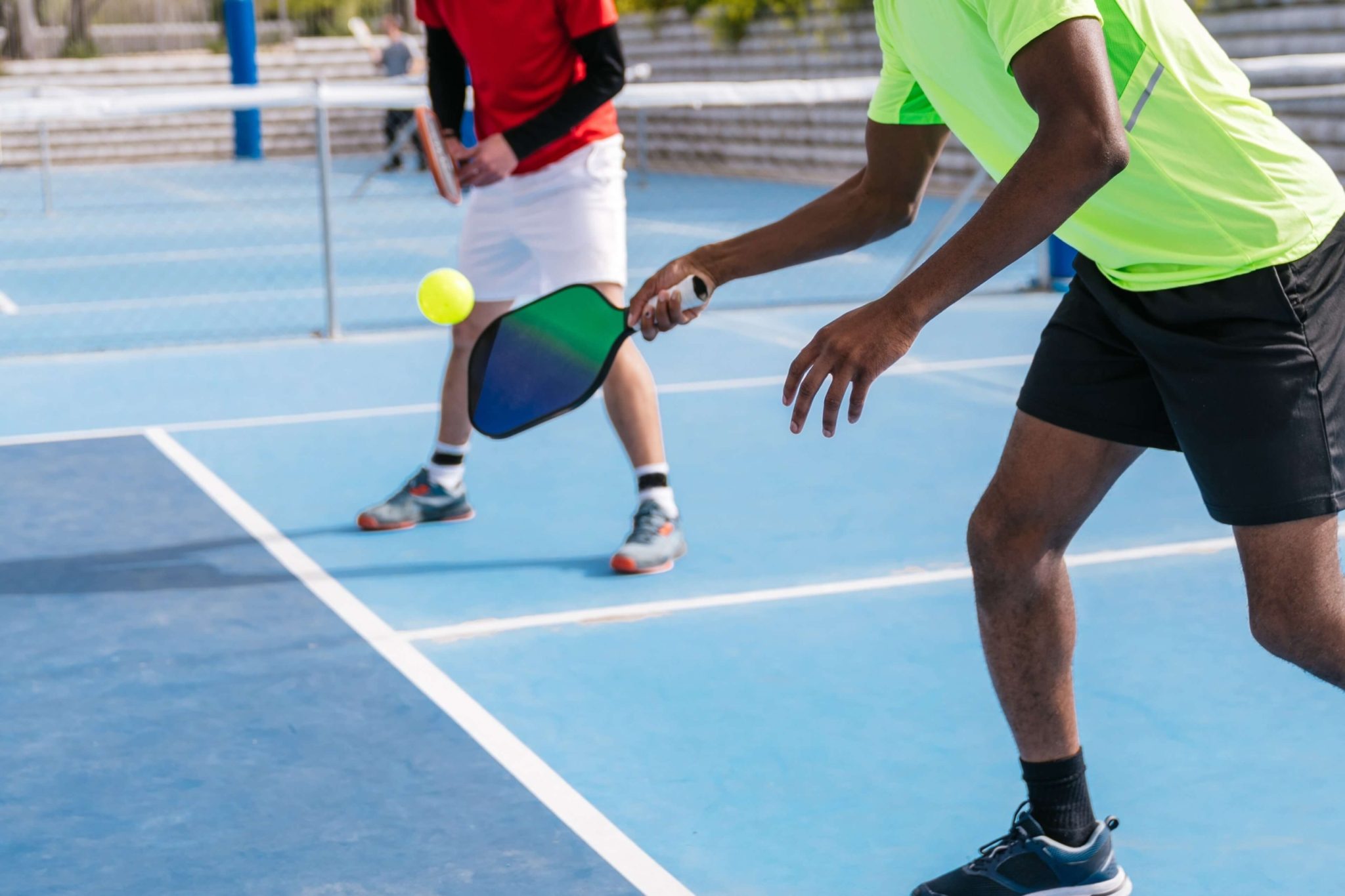 Two people playing Pickleball in New Braunfels.